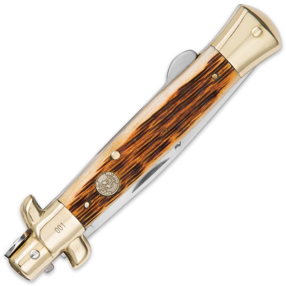 Kissing Crane Amber Bone Stiletto Pocket Knife closed with jigged bone handle and brass bolsters
