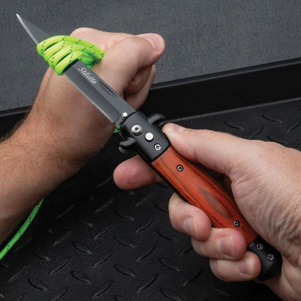 Gangster's edge automatic stiletto knife closed with wood inlay handle and stainless steel construction