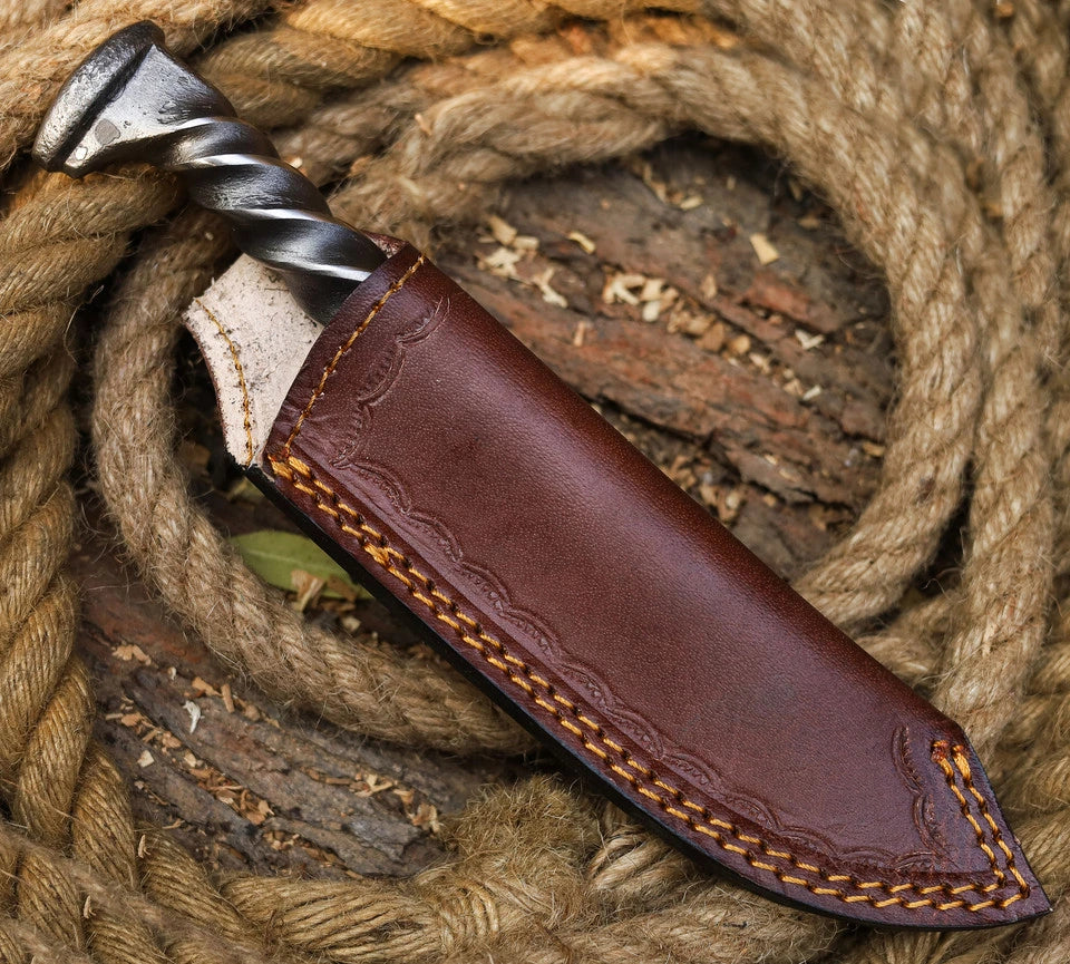 Hand forged twisted railroad spike knife full view with leather sheath and belt loop