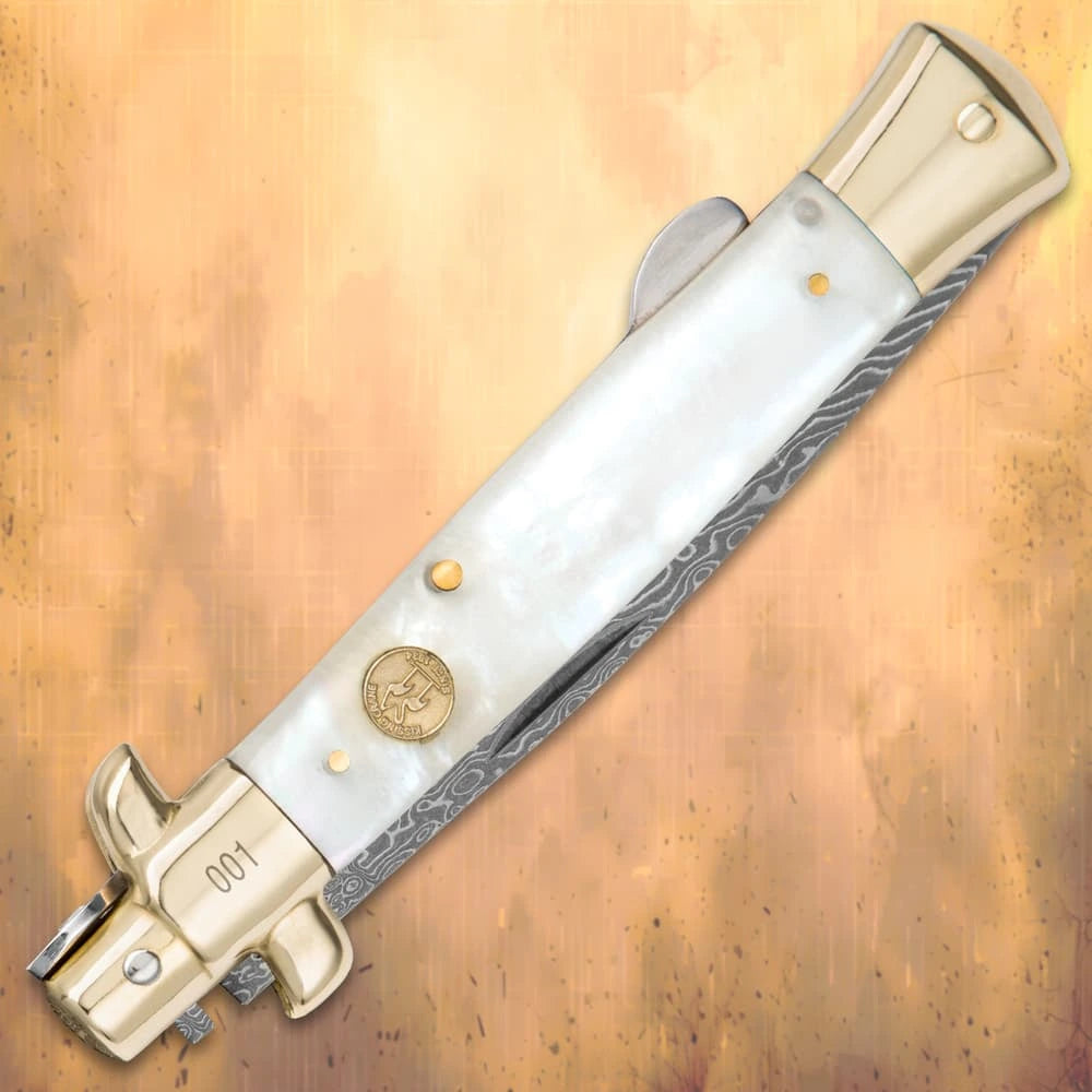 Luxury Damascus pearl stiletto folder closed with genuine white pearl handle and brass bolsters
