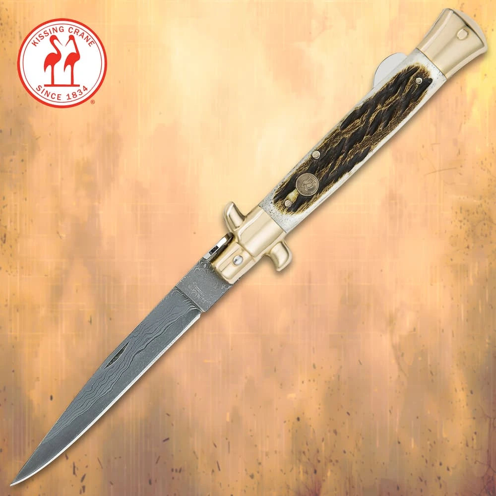 Luxury Damascus pearl stiletto folder closed with genuine white pearl handle and brass bolsters