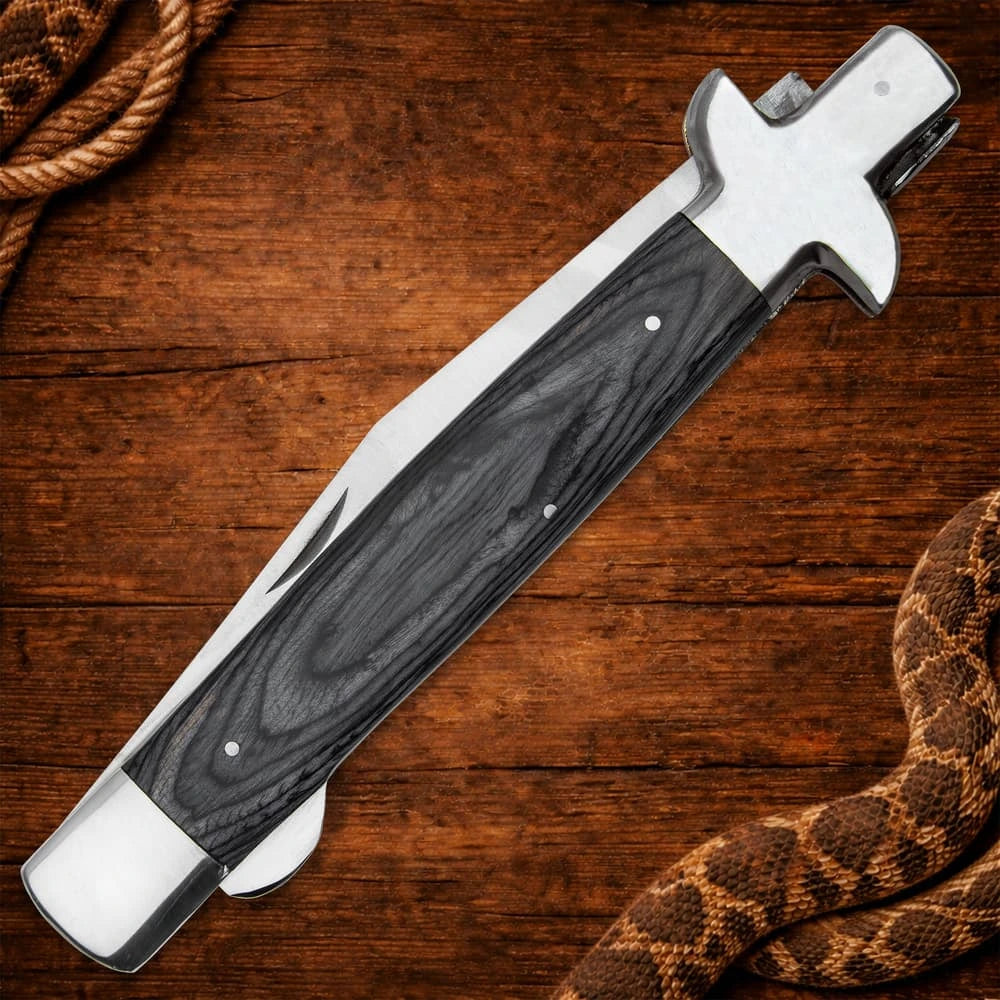 Monster gray pakkawood stiletto pocket knife closed with massive 18 inch overall length and stainless bolsters