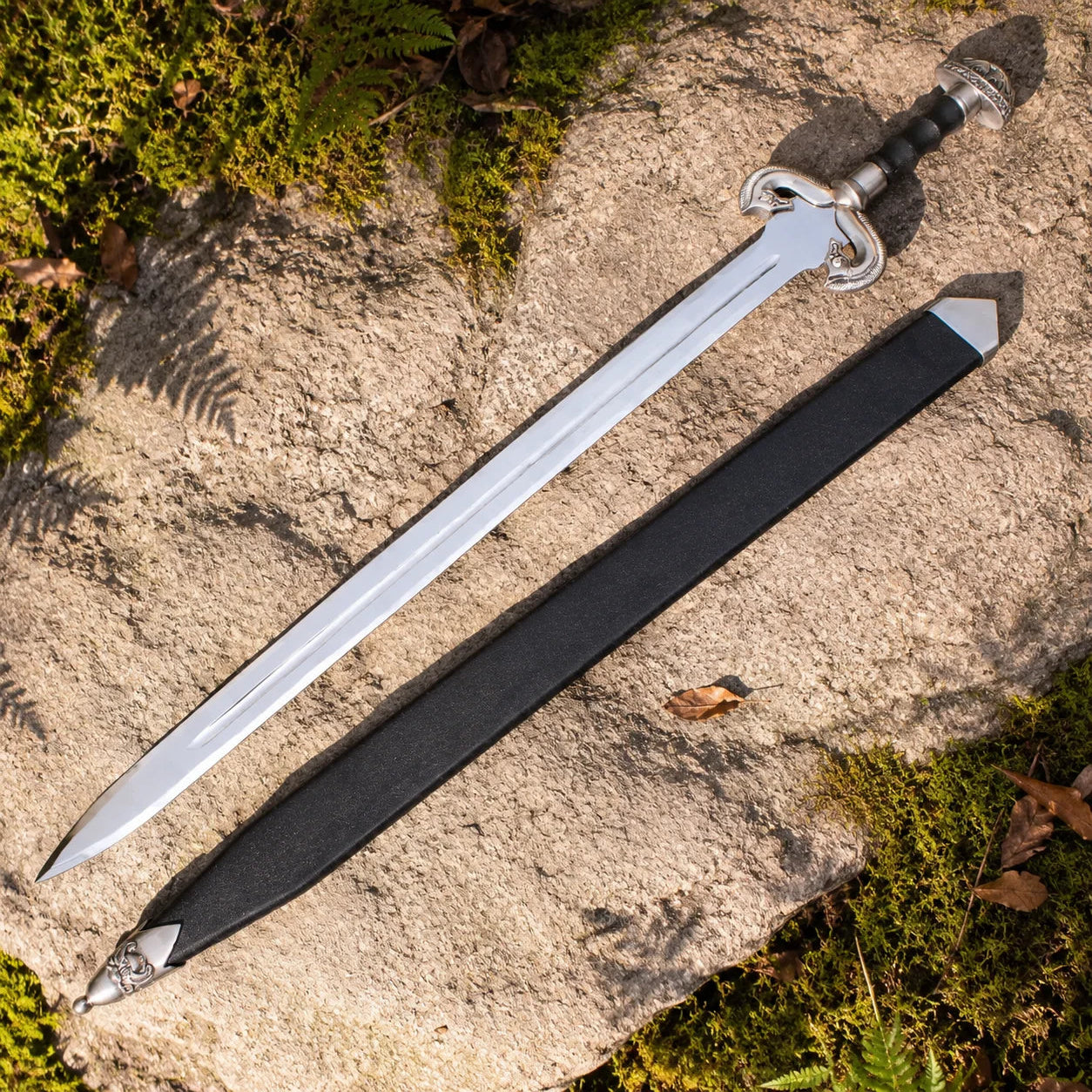 Eowyn Sword Lord of the Rings display replica collectible with silver and gold-tone fantasy styling, dark handle, and collectible Rohan decor presentation