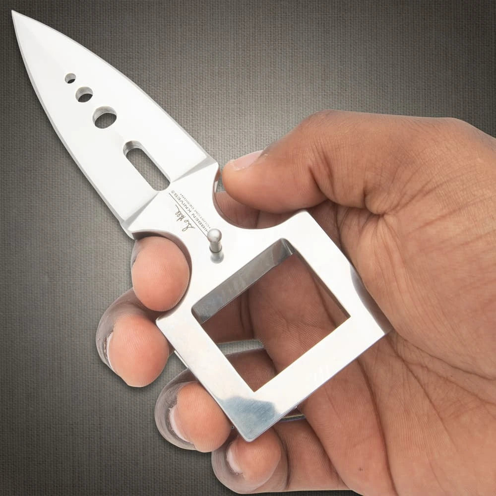 Hidden belt buckle knife open showing 3.25 inch stainless steel blade tucked discreetly