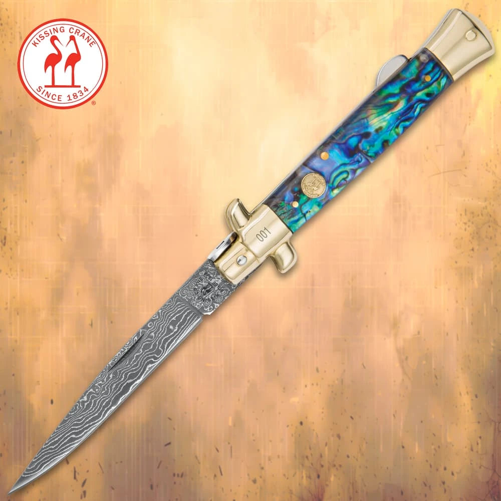 Luxury Damascus pearl stiletto folder closed with genuine white pearl handle and brass bolsters