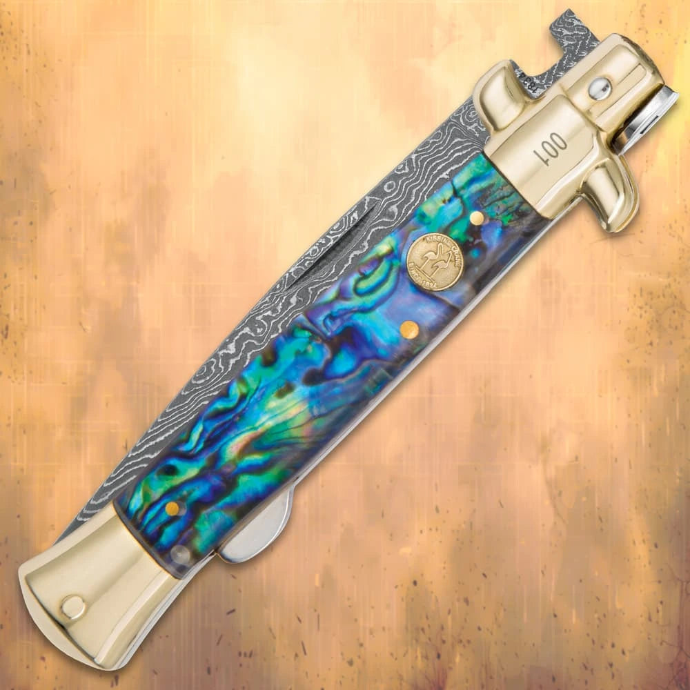 Luxury Damascus pearl stiletto folder closed with genuine white pearl handle and brass bolsters