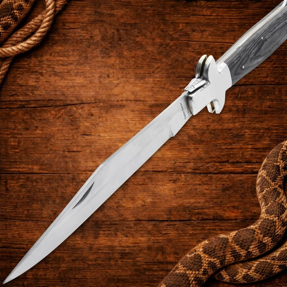 Monster gray pakkawood stiletto pocket knife closed with massive 18 inch overall length and stainless bolsters